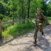 Staff Sgt. Trevor Thompson runs towards a marker