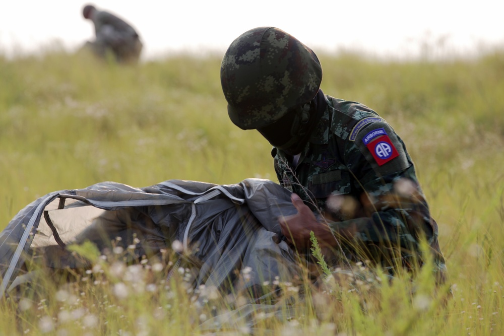 A Royal Thai Army Paratrooper Packs Away Parachute