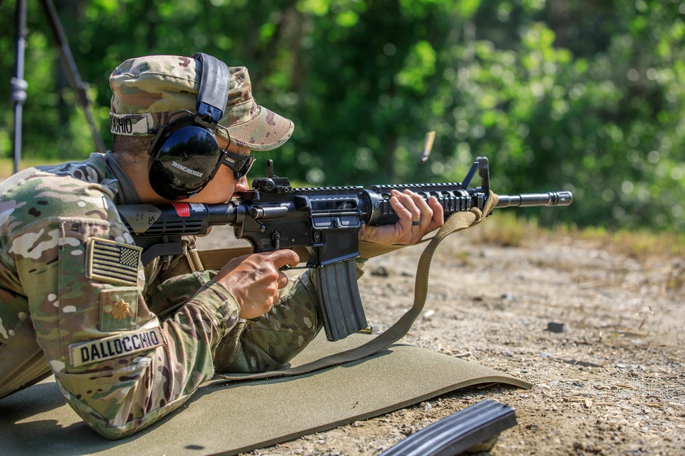 Maj. Nicole Dallocchio fires an M4 rifle
