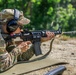 Maj. Nicole Dallocchio fires an M4 rifle