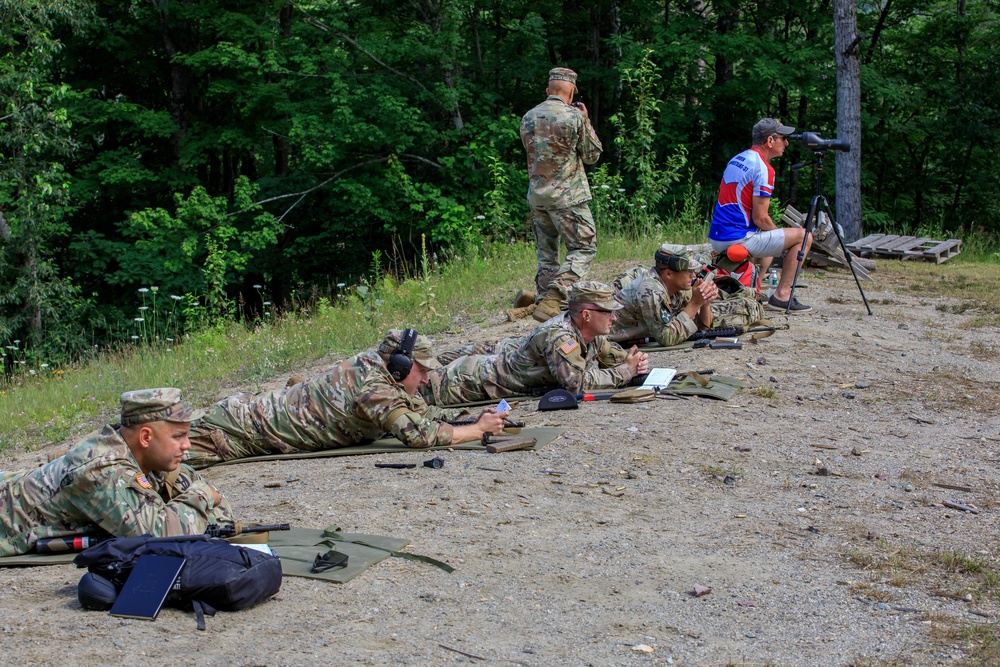 U.S. Reserve service members check their targets after firing their M4 rifles