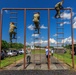 U.S. Reserve service members climb down an obstacle