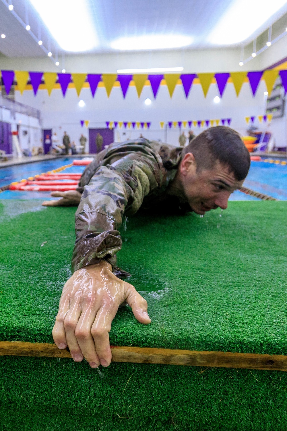 Maj. James Fink climbs up a platform