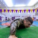 Maj. James Fink climbs up a platform