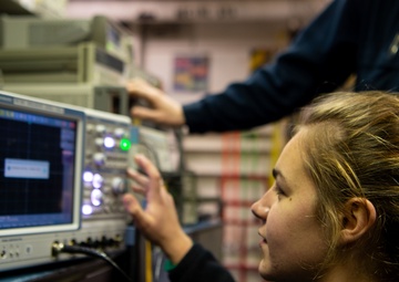 USS Carl Vinson (CVN 70) Sailor Tests Equipment