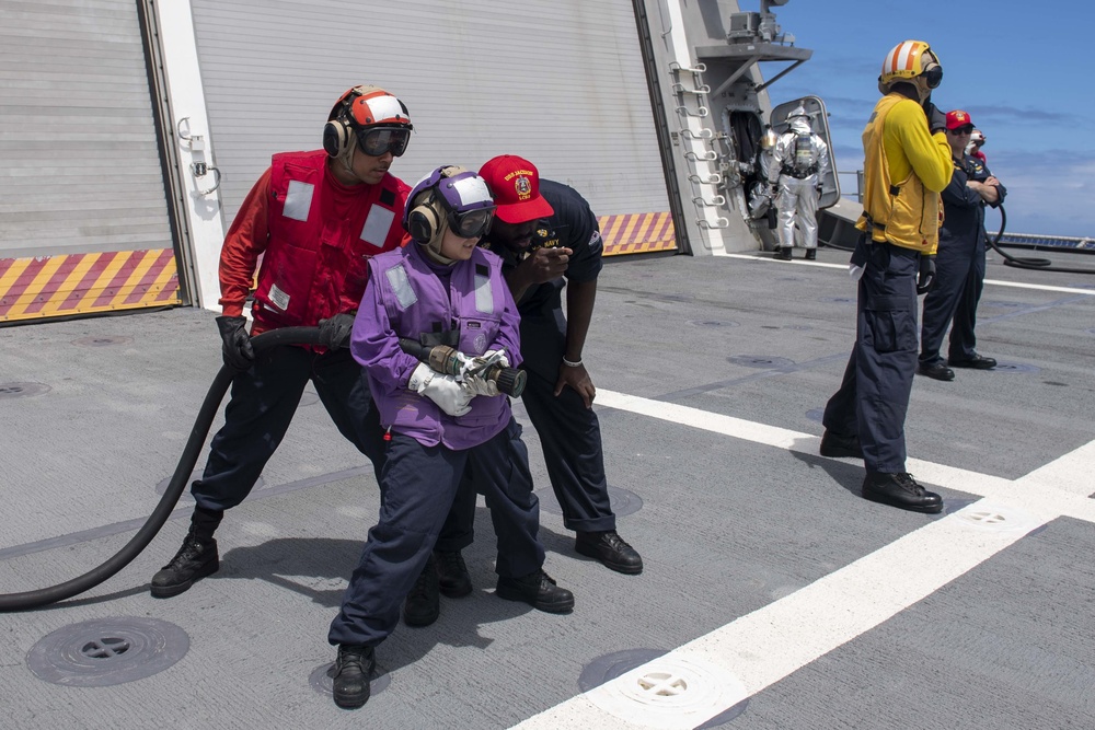 USS Jackson (LCS 6) Sailors fight simulated fire
