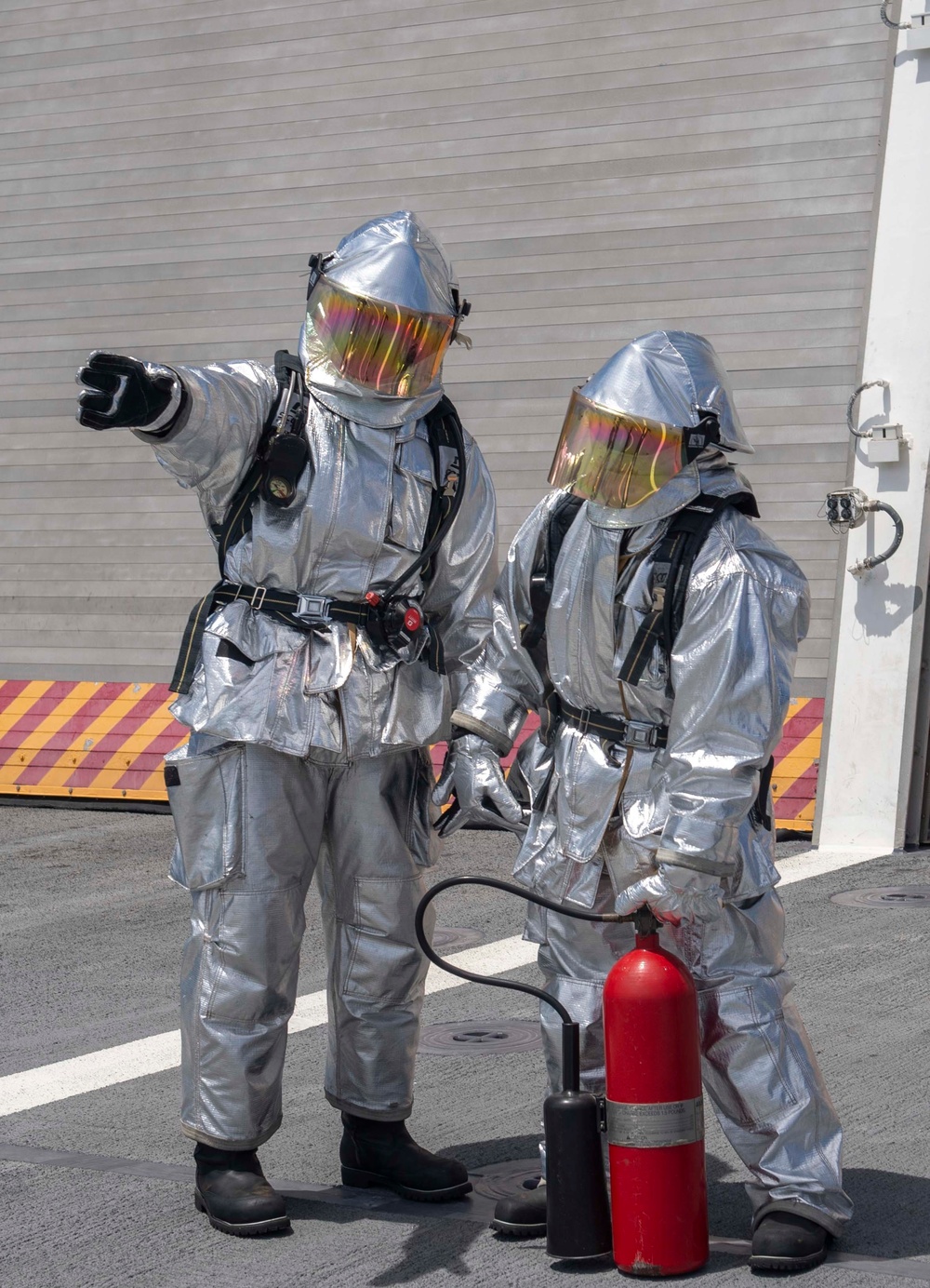 USS Jackson (LCS 6) Sailors stand reflash watch during firefighting drill
