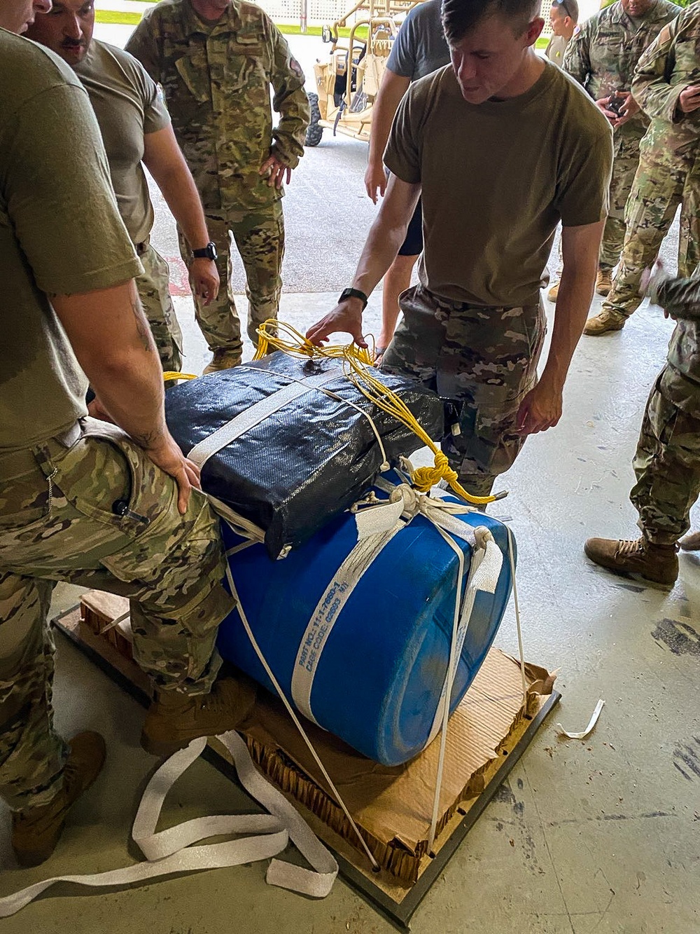 Parachute riggers with 1st SFG (A), 82nd Airborne, US Navy collaborate in building lifesaving apparatus