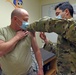 Staff Sgt. Daniel Contreras, a medical technician in the 419th Medical Squadron, administers a COVID-19 vaccine to Lt. Col. Brent Milne, a dentist in the MDS, Jan. 9, 2021, at Hill Air Force Base, Utah