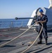 USS Billings Sailor Handles Line During Sea and Anchor Detail