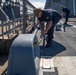 USS Billings Sailor Heaves Around a Line During Sea and Anchor Detail
