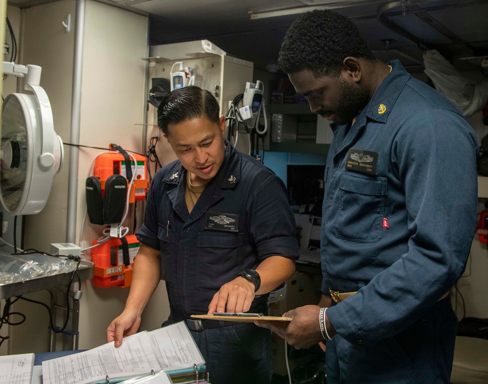 USS Jackson (LCS 6) Sailors perform spot check