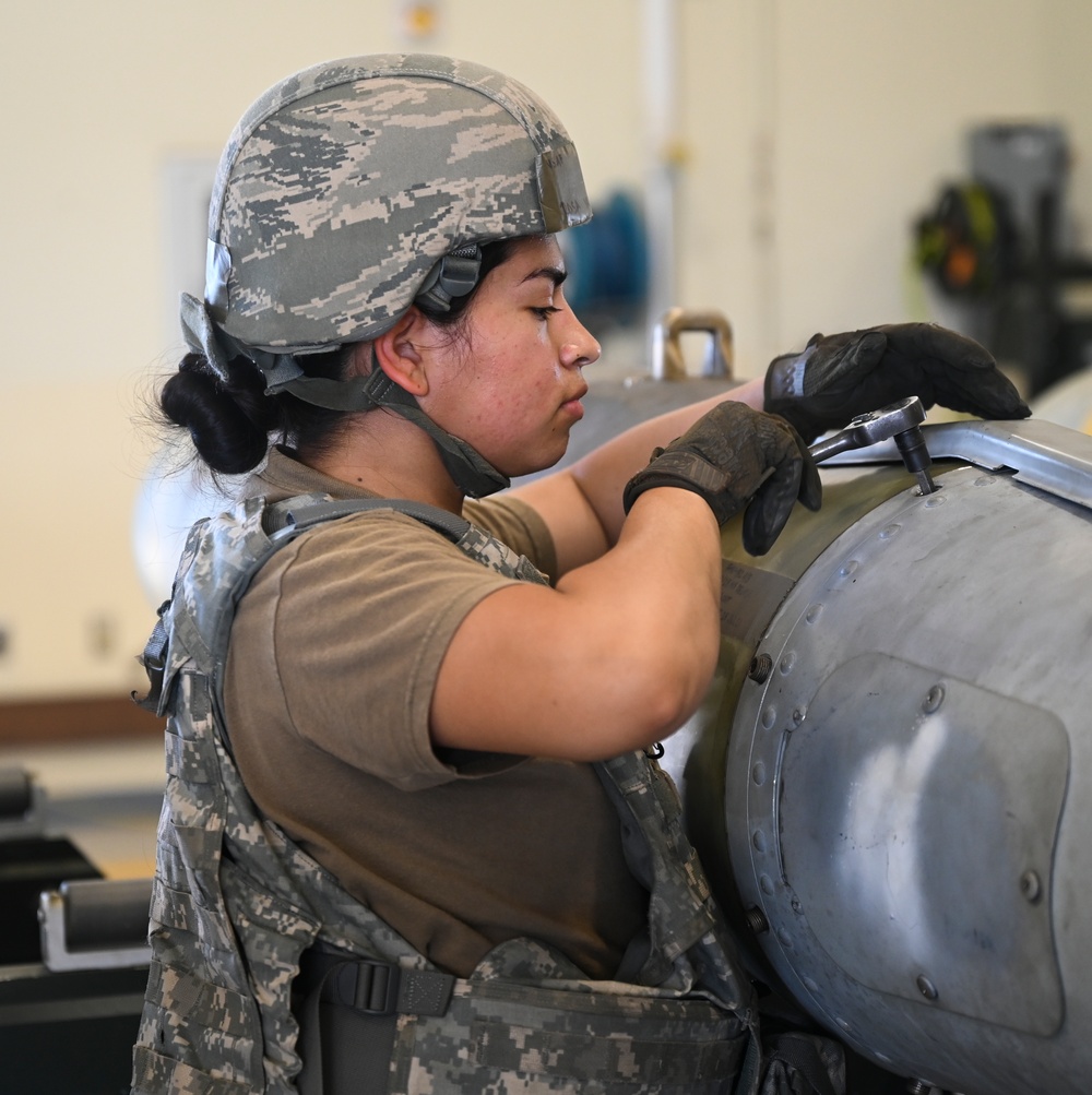 Munitions specialists keep the Wolf Pack locked, loaded