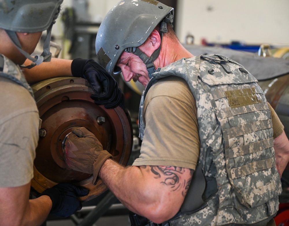 Munitions specialists keep the Wolf Pack locked, loaded