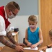 Chief Culinary Specialist Dorrance Larson promotes USS Constitution at the Boys and Girls Club in Fargo, North Dakota