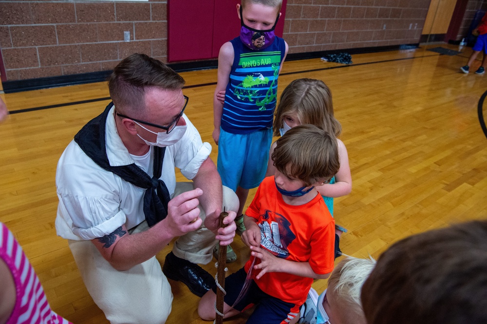 Boatswain’s Mate 2nd Class Kevin Crowder promotes USS Constitution at the Boys and Girls Club in Fargo, North Dakota