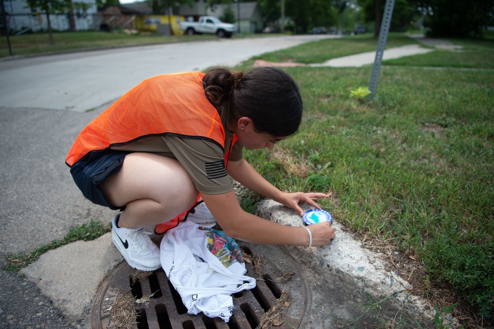 USS Constitution Sailors mark sewage drains during the Fargo, North Dakota Navy week