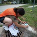 USS Constitution Sailors mark sewage drains during the Fargo, North Dakota Navy week