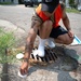 USS Constitution Sailors mark sewage drains during the Fargo, North Dakota Navy week