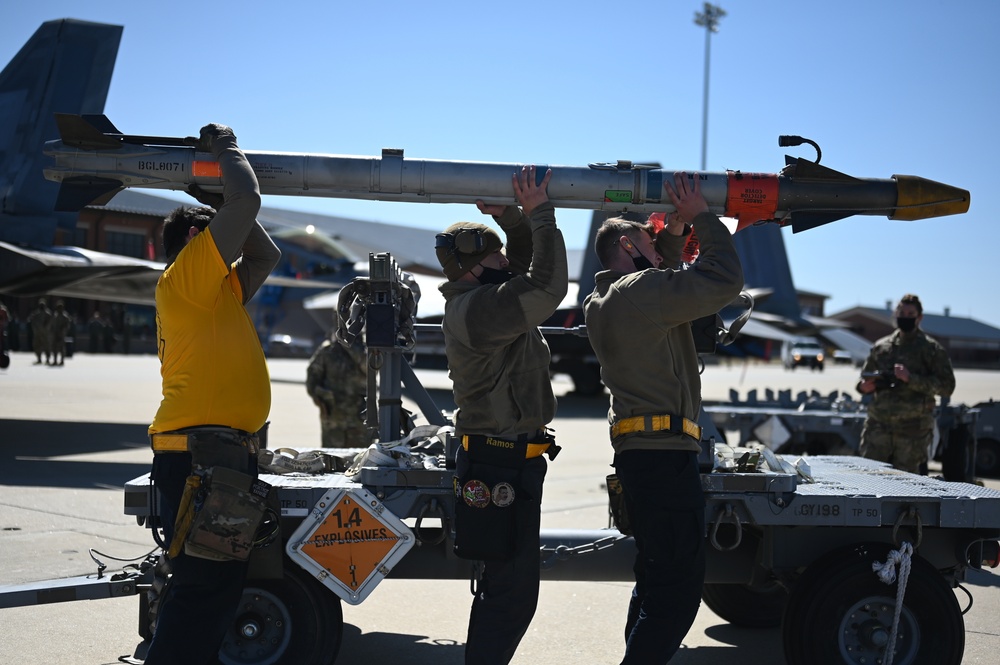 Load crew carries missile
