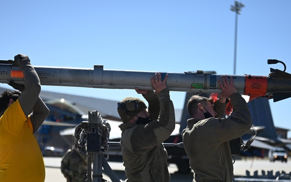 Load crew carries missile