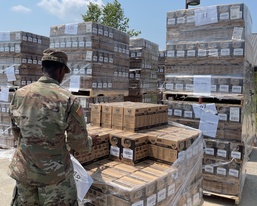 101st Airborne Division (Air Assault) Soldier unloads K-Cups for distribution.