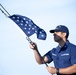 USCGC Brant Crew Member Posts Union Jack Flag