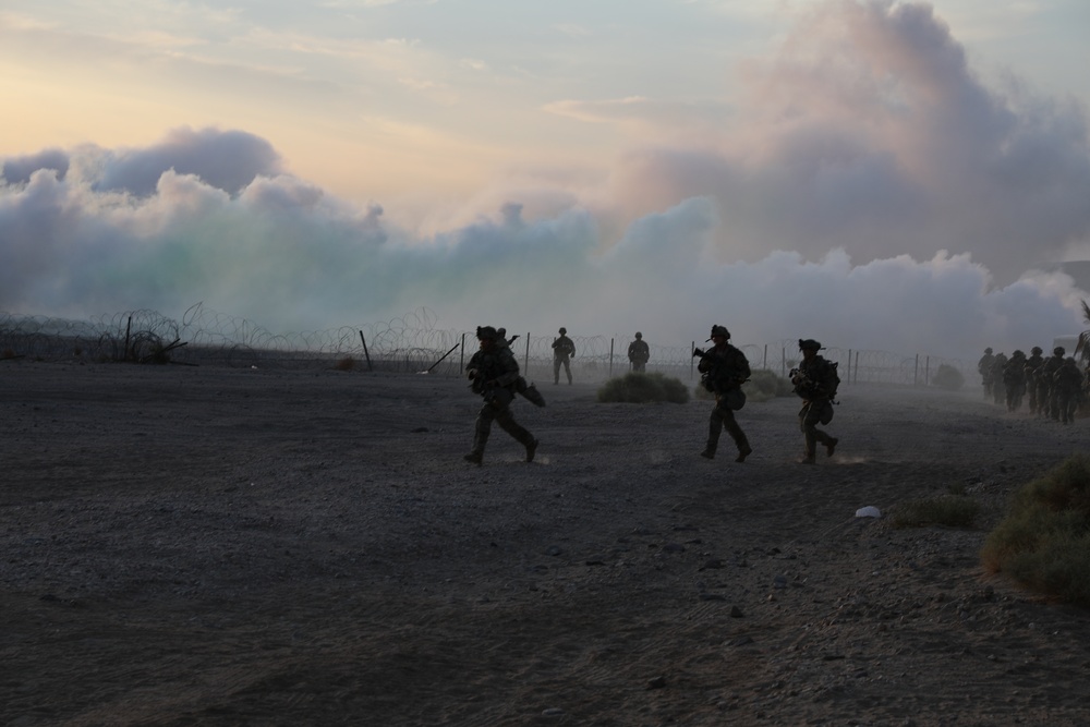 Soldiers of the 45th Infantry Brigade Combat Team successfully enter the mock city of Ujen using smoke as concealment