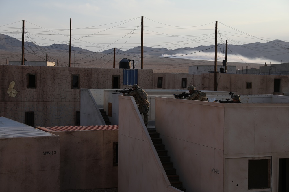 Members of the 45th Infantry Brigade Combat Team provide rooftop security