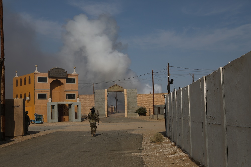 Smoke being used as concealment by the 45th Infantry Brigade Combat Team billows over the mock city of Ujen