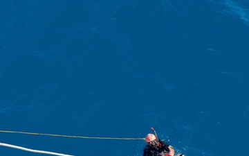 SAR swimmer retrieves &quot;Oscar&quot; during man overboard training.