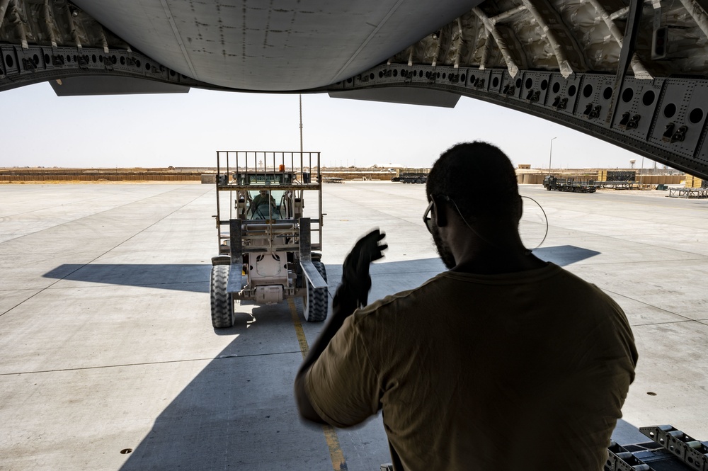 U.S. Air Force Airmen Prepare to Unload Cargo