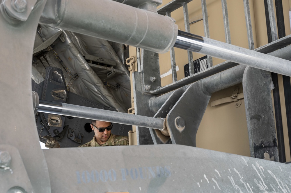 U.S. Air Force Loadmaster Helps Unload Cargo