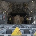 U.S. Air Force Loadmaster Guides A Container Loader
