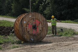 Airmen install fiber optics cables at Camp Ripley