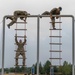 The veteran team representing the United States of America, climbs an obstacle