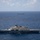 USS Billings and USS Sioux City Transit Together in the Caribbean Sea Two U.S. Navy Littoral Combat Ships (LCS) are operating in open ocean waters under partly cloudy skies. The foreground vessel displays the hull number '11' and exhibits the characteristic trimaran or monohull design of the Freedom or Independence class LCS. A second similar vessel is visible in the background at a considerable distance.