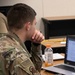 Senior Airman Logan Lathrop scans his screen for threats during Cyber Dawn 2021