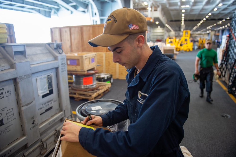 USS Carl Vinson (CVN 70) Sailor Conducts Inventory