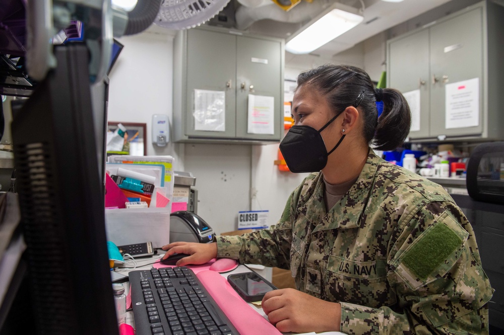 USS Carl Vinson (CVN 70) Sailor Conducts Patient Care