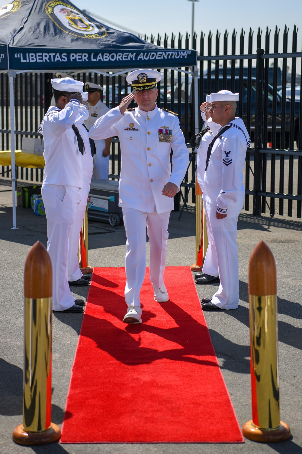 Capt. John Fay, Commodore, LCSRON ONE, arrives at USS Independence (LCS 2) decommisioning