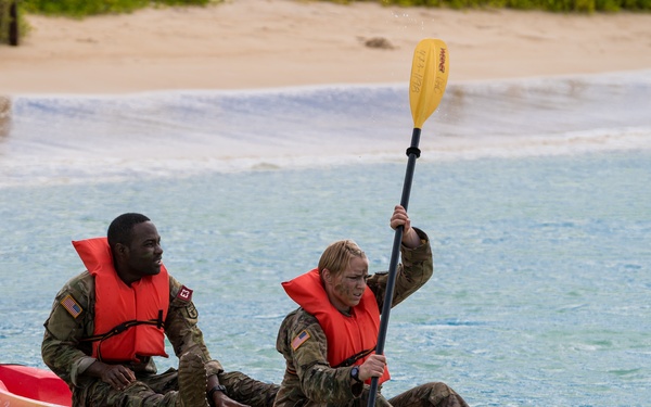 U.S. Army Staff Sgt. James Gabisum and 1st Lt. Paige Runco, with Regional Health Command- Europe, row to checkpoint during the U.S. Army Medical Command (MEDCOM) 2021 Best Leader Competition