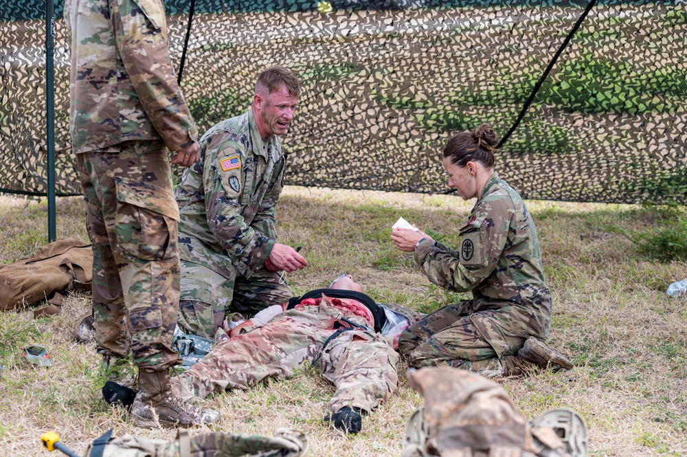U.S. Army 1st Sgt. James Buchanan and Capt. Megan Balcom, from Regional Health Command- Central, provide medical aid during the U.S. Army Medical Command (MEDCOM) 2021 Best Leader Competition,