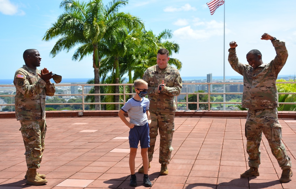 Maj. A.J. Galdi's son, Avery, does an Army Medicine call and response with Command Sergeant Major Diamond Hough