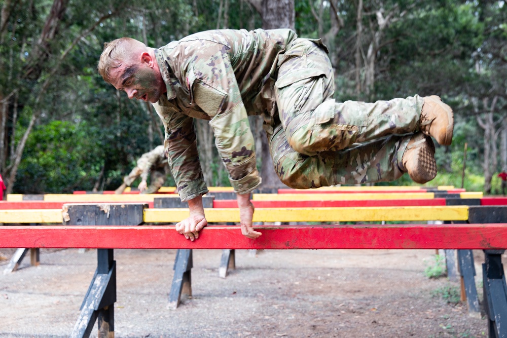 Combat Medic 1st Sgt. James Buchanan jumps through the Six Vaults during the Army Medicine 2021 Best Leader Competition