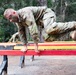 Combat Medic 1st Sgt. James Buchanan jumps through the Six Vaults during the Army Medicine 2021 Best Leader Competition