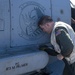 Lt. Cmdr. Steve Kohl, from Virginia Beach, V.A., conducts maintenance on an MH-60R Seahawk assigned to the “Warlords” of Helicopter Maritime Strike Squadron (HSM-51)