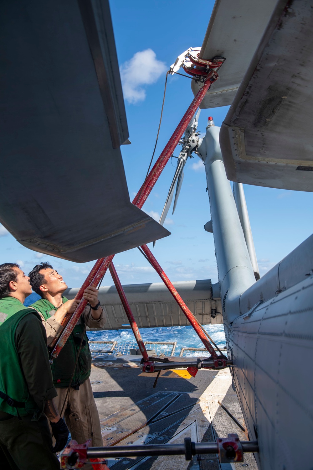 Aviation Electronics Technician 2nd Class Kayla Spencer, from Milton, Fla., conducts maintenance on an MH-60R Seahawk assigned to the “Warlords” of Helicopter Maritime Strike Squadron (HSM-51)