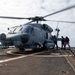 Sailors refuel an MH-60R Seahawk assigned to the “Warlords” of Helicopter Maritime Strike Squadron (HSM-51)