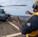 Sailors disembark an MH-60R Seahawk assigned to the “Warlords” of Helicopter Maritime Strike Squadron (HSM-51)